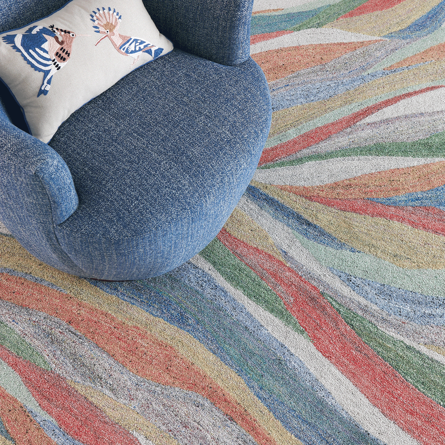 wavy striped rug with blue chair Desertscape
